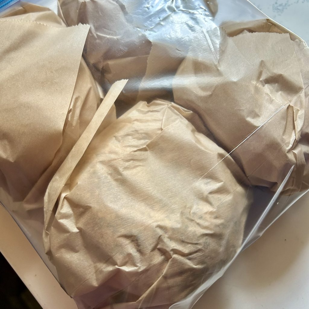 Breakfast sandwiches wrapped in parchment paper